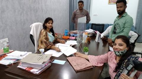 India, Samarthyam 13. OPD woman leader handing over a letter to the Additional District Collector to form the district-level monitoring committee
