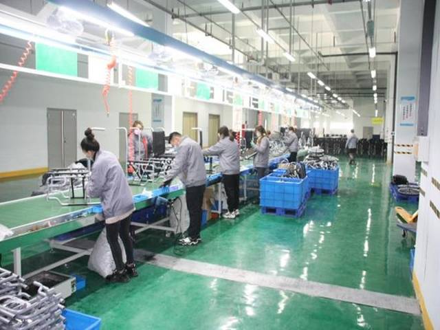 Persons with disabilities trained and employed by a medical equipment factory