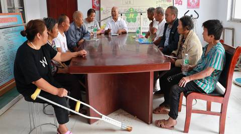 China, ZDPF 9. Self-help group of persons with disabilities, their family members and community leaders having a meeting